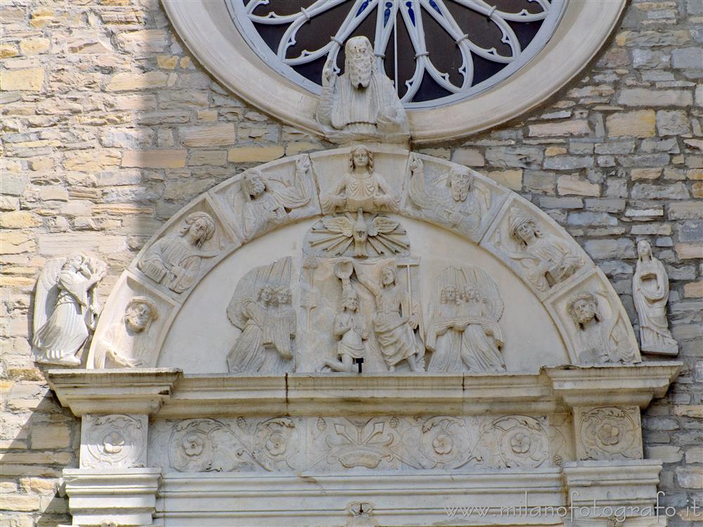 Torno (Como, Italy) - Lunette of the portal of the Church of Saint John the Baptist